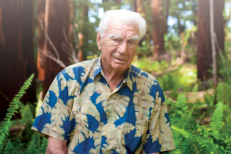 Photo of Edmund C. Olson with a nature background